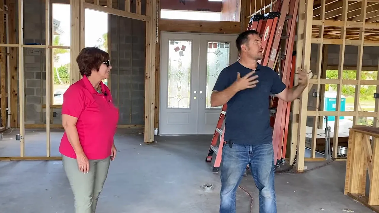 Framing reveals multiple rooms and the home’s layout
