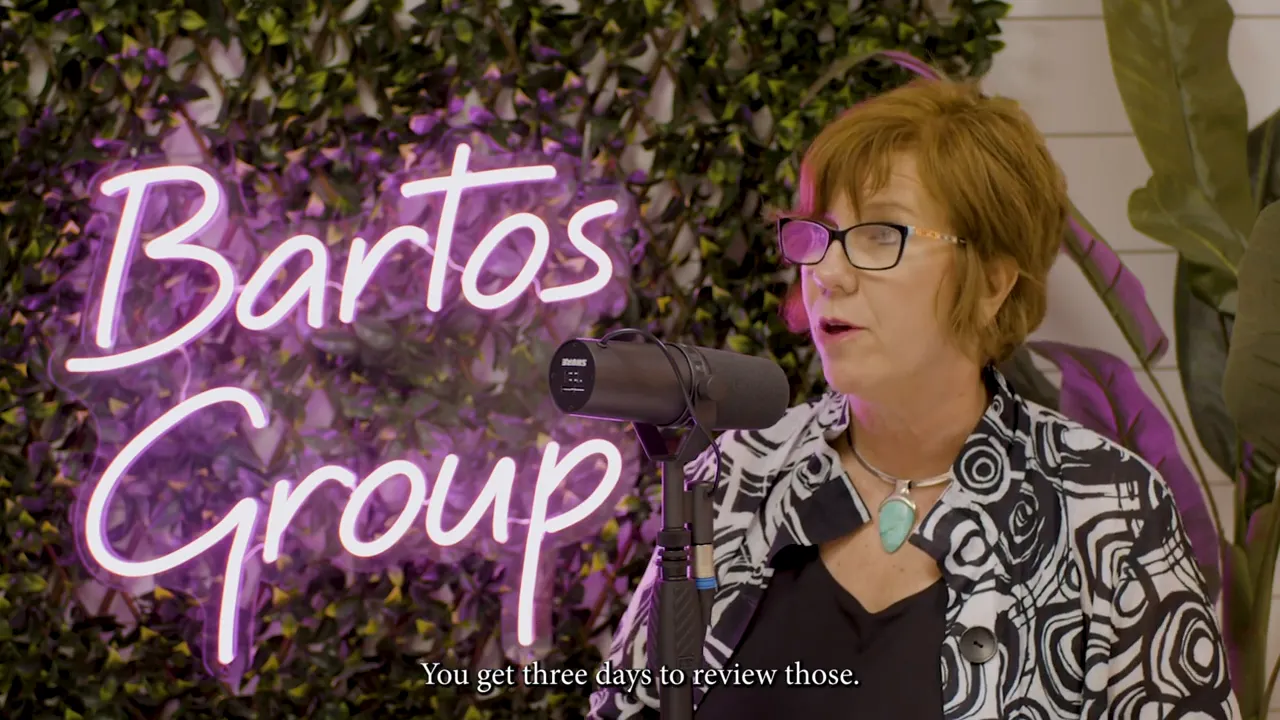 Speaker at a podcast-style panel in front of a neon 'Bartos Group' sign with subtitle 'You get three days to review those.'