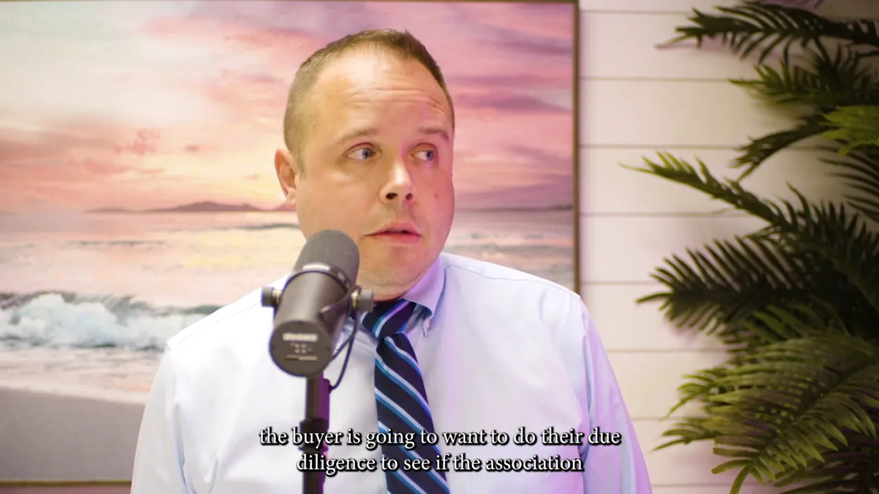 Male speaker at a microphone in a studio setting discussing inspection outcomes