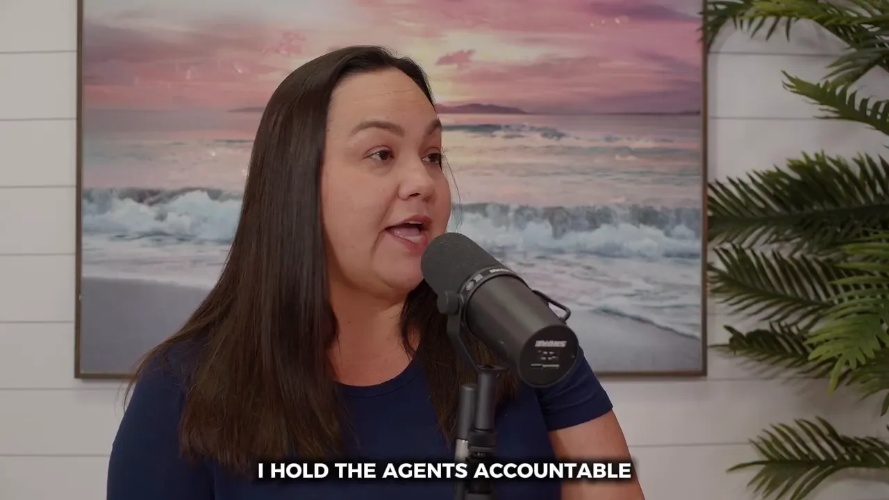 Woman at a podcast microphone with beach artwork and plants, talking about being sales leader