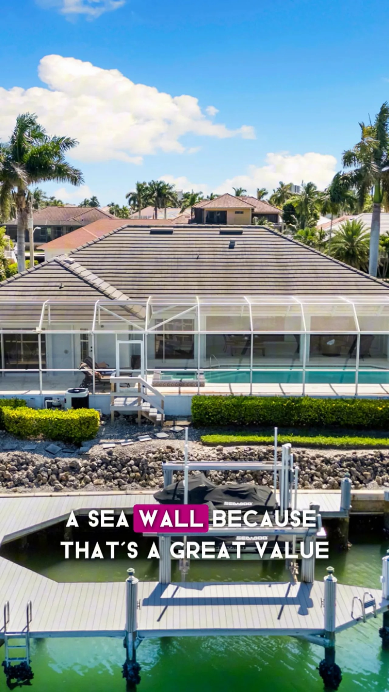Waterfront house with seawall, dock and boat lift protecting the shoreline
