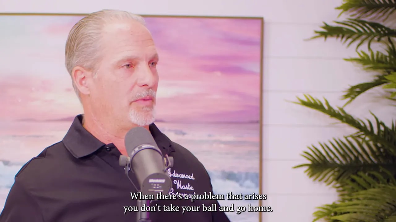 Investor at microphone delivering the line 'When there's a problem that arises you don't take your ball and go home.'