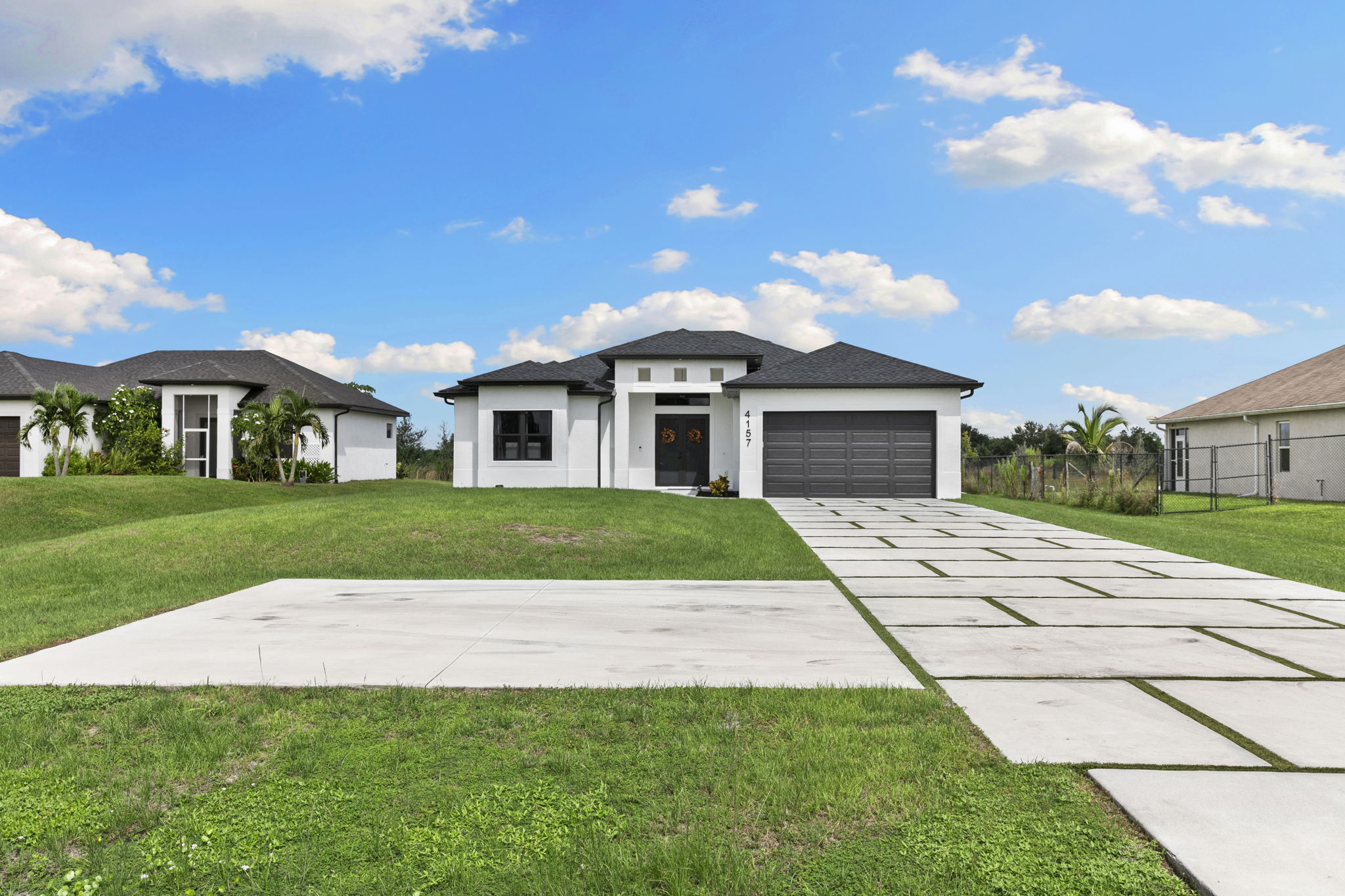 Naples Home No HOA featuring 1.14 acres, 2025 construction, modern upgrades, whole-house RO system, and spacious living near shopping and dining.